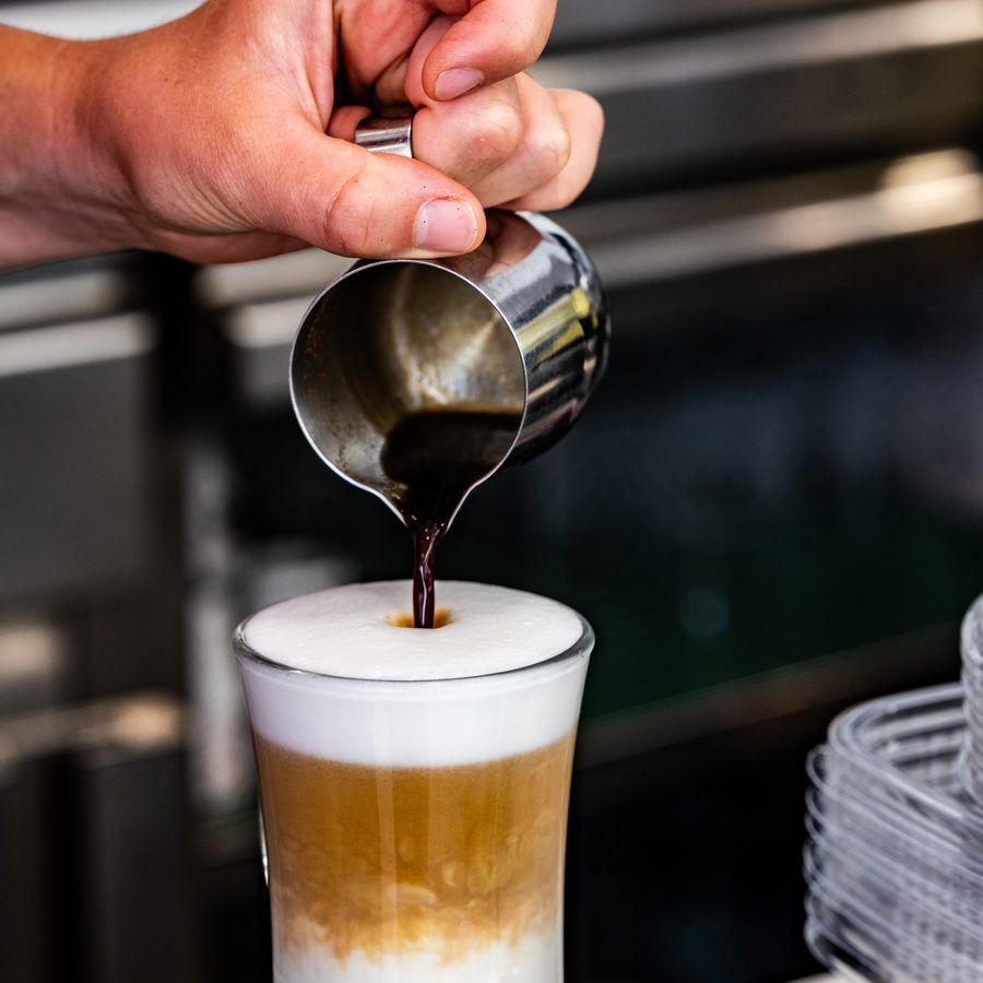 Espresso being poured into a glass.