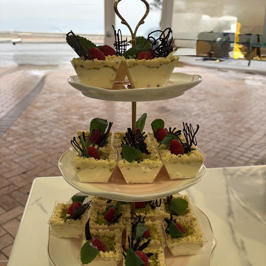 A pastry and canapé tower set up on the terrace.