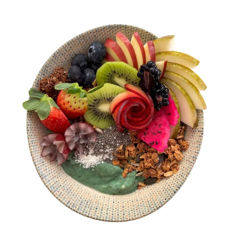 Green Ocean smoothie bowl with spirulina, mango, banana and granola.