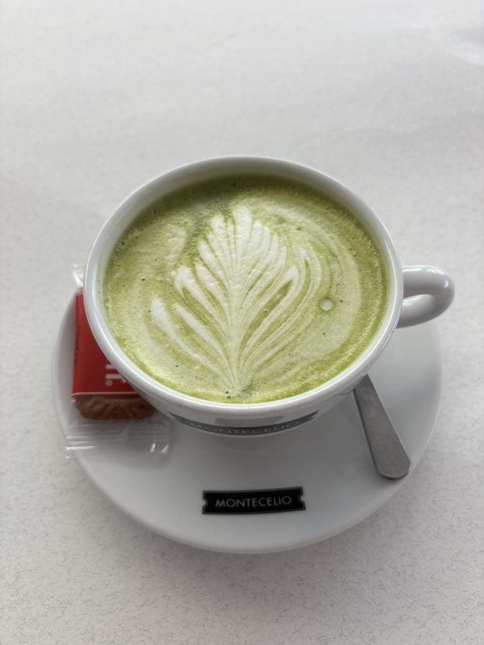 A matcha latte with latte art.